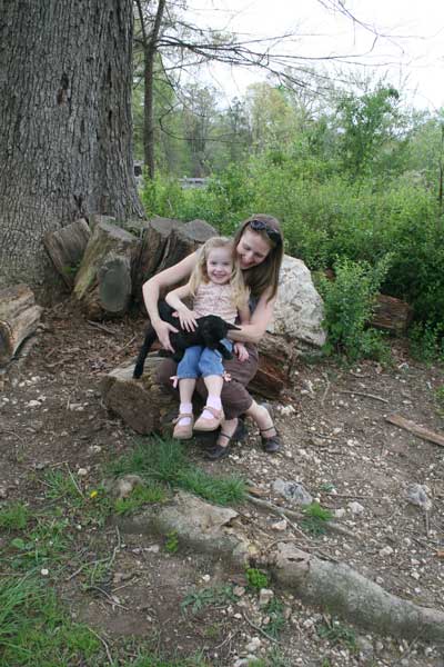 visitors enjoy some time with the goat kids