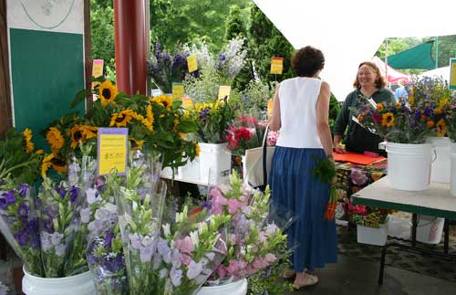 Betsy with her cut flowers at the Carrboro Farmers' Market