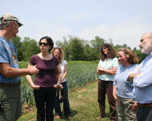 Alex explains the Peregrine farming system to the visitors