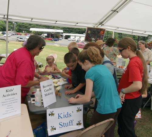 Pat shows kids how to make beeswax candles