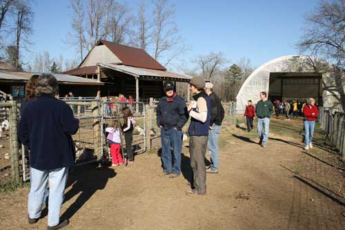 visitors tour the farm
