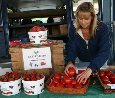 Donna Lee sells tomatoes at the market