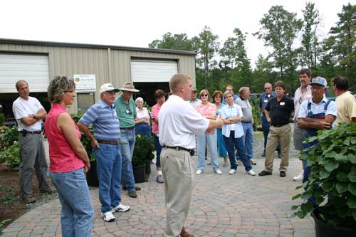 Joe Smith talks with group