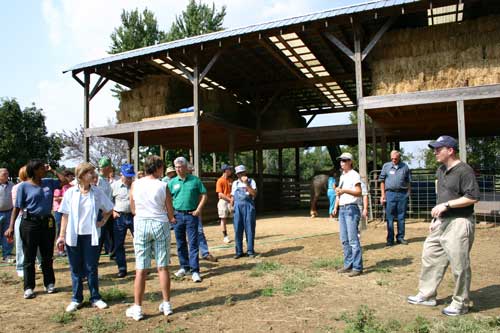 Lynn with group in front of barn