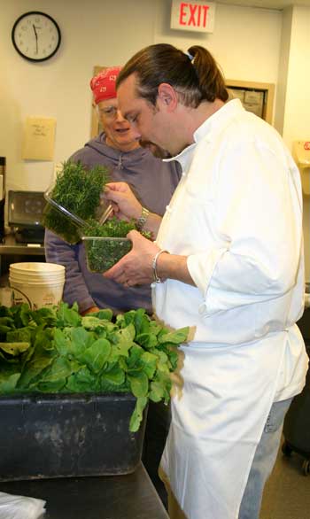 Chef Sam Poley checks out the fresh herbs at Starlu