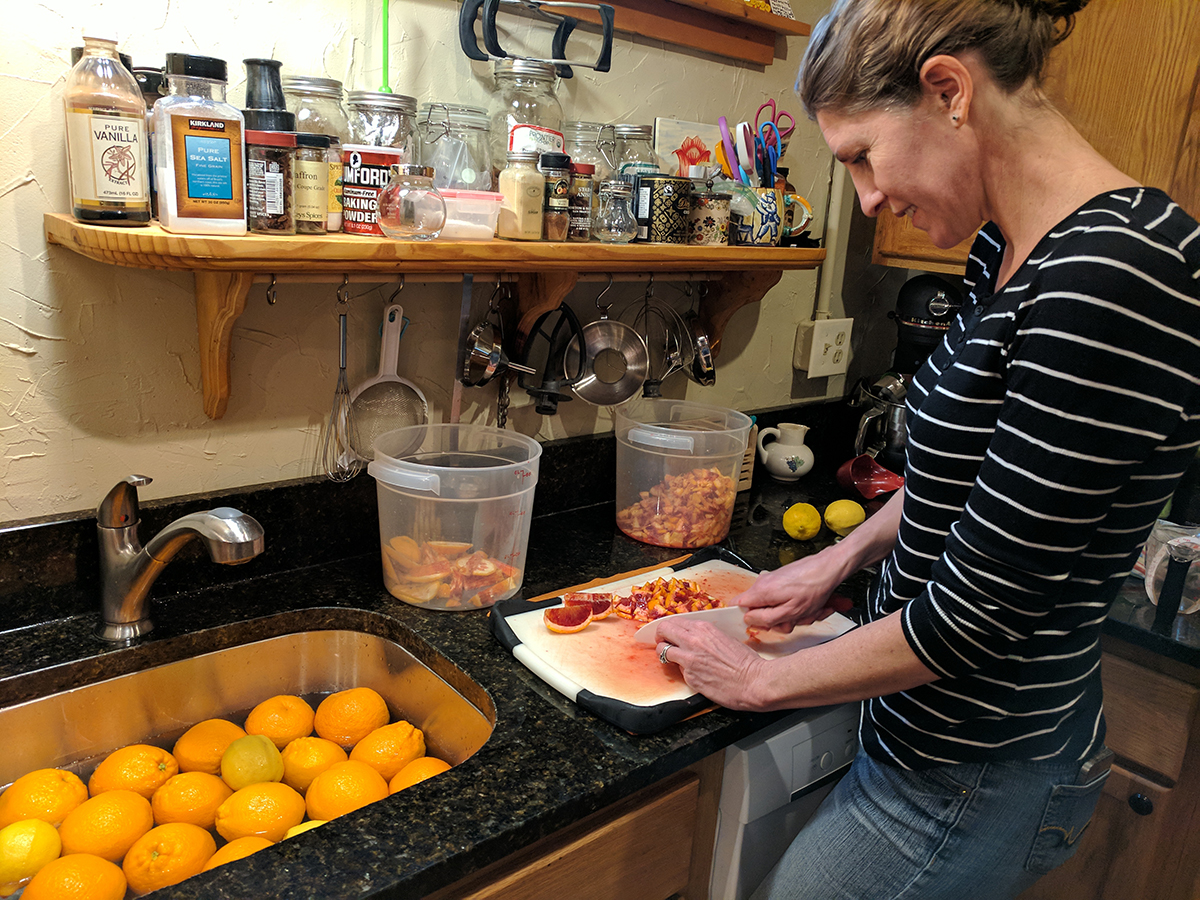 Katie Thornburg cuts up blood oranges for marmalade. 