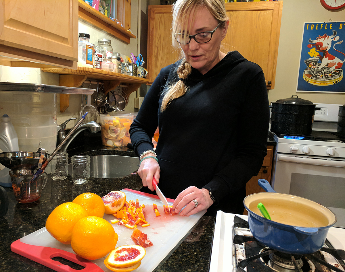 Emily Boynton cutting up blood oranges to make marmalade. 