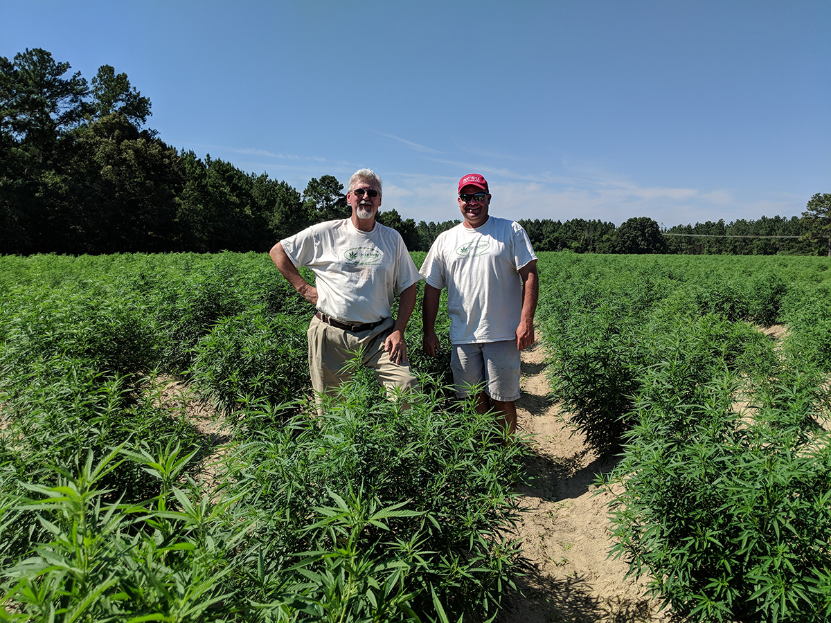 Rudy Mullis (left) with grower Ryan Patterson. 