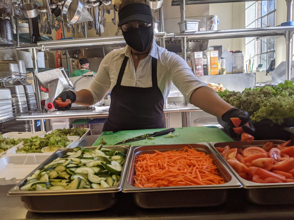 Zulema prepares salads