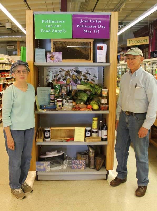 Judy and Jim Pick at a Pollinator Day display in Chatham Marketplace