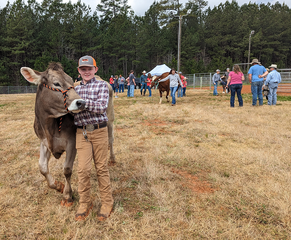 Levi Blackwood with his calf for the Parade of Breeds