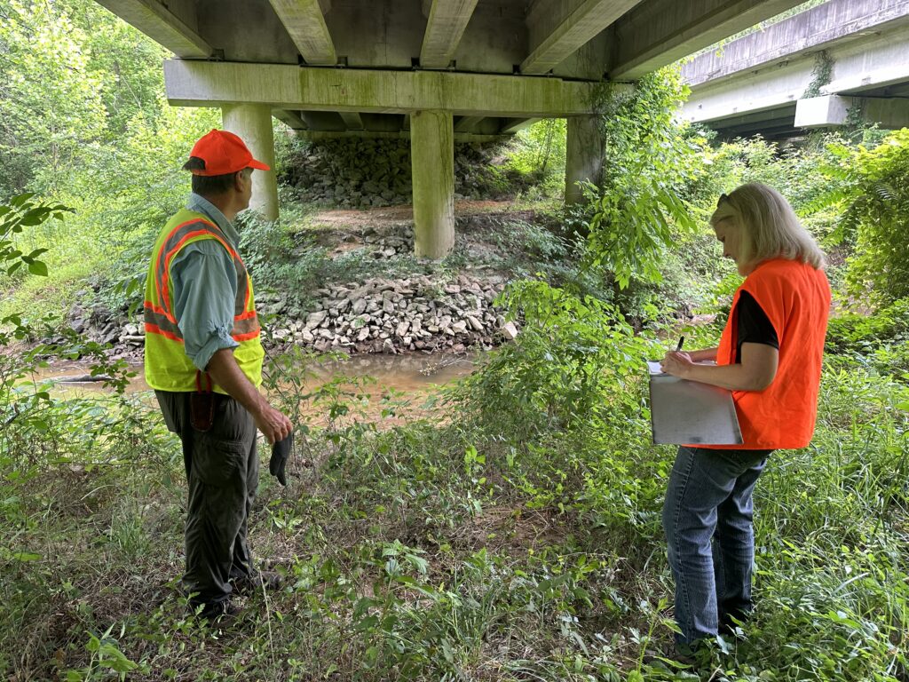 Assessing wildlife passage under a bridge. 