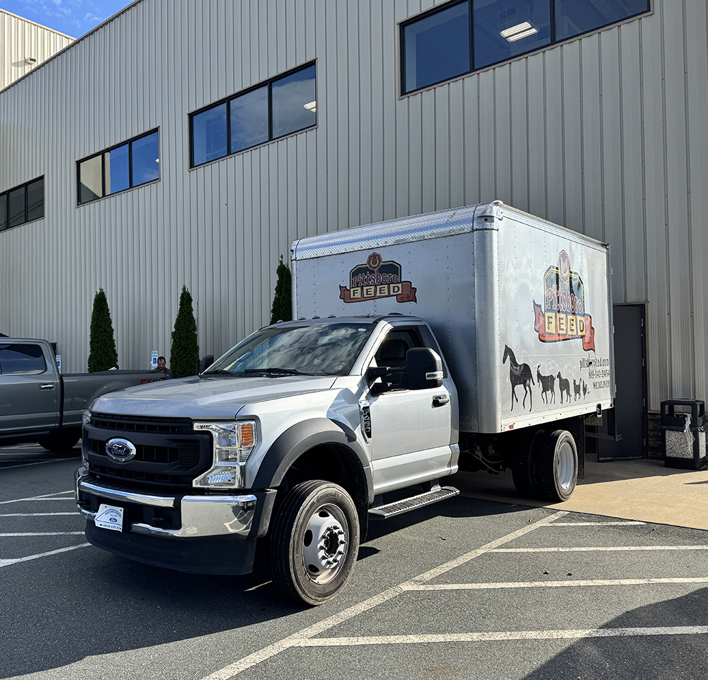 Pittsboro Feed truck delivering to The Lamb's Chapell in Burlington before distribution to western NC.