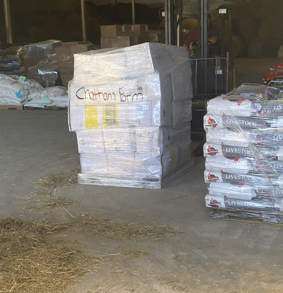 This pallet contains enough step-in posts, polywire, and solar chargers to set up 20 farmers with temporary fencing for their livestock. It awaits distribution in an Avery County warehouse. 