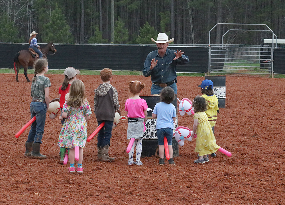 Rodeo entertainer Keith Isley led a stick pony race for the kids that was both adorable and hilarious. 