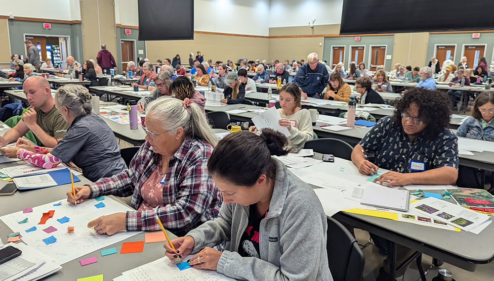 Workshop participants work on their pollinator garden design.